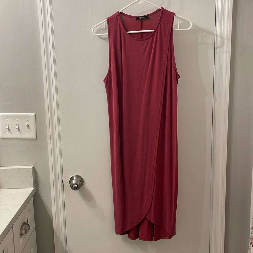 KLD dress in a wine color. Sort of a wrap design. Sleeveless.